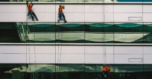 team of professional window cleaners in Manhattan working on exterior windows