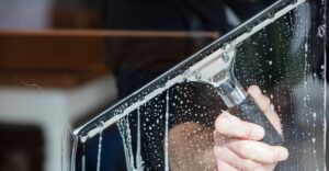 close up of squeegee on window