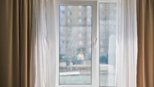 A blurry window looking out toward the city